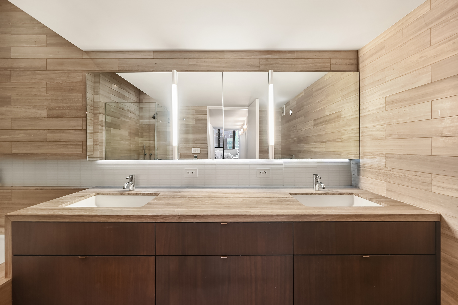 421 Hudson Street, Unit 318 Manhattan, NY 10014 - Photo 8 of 12 a bathroom with a sink and a mirror