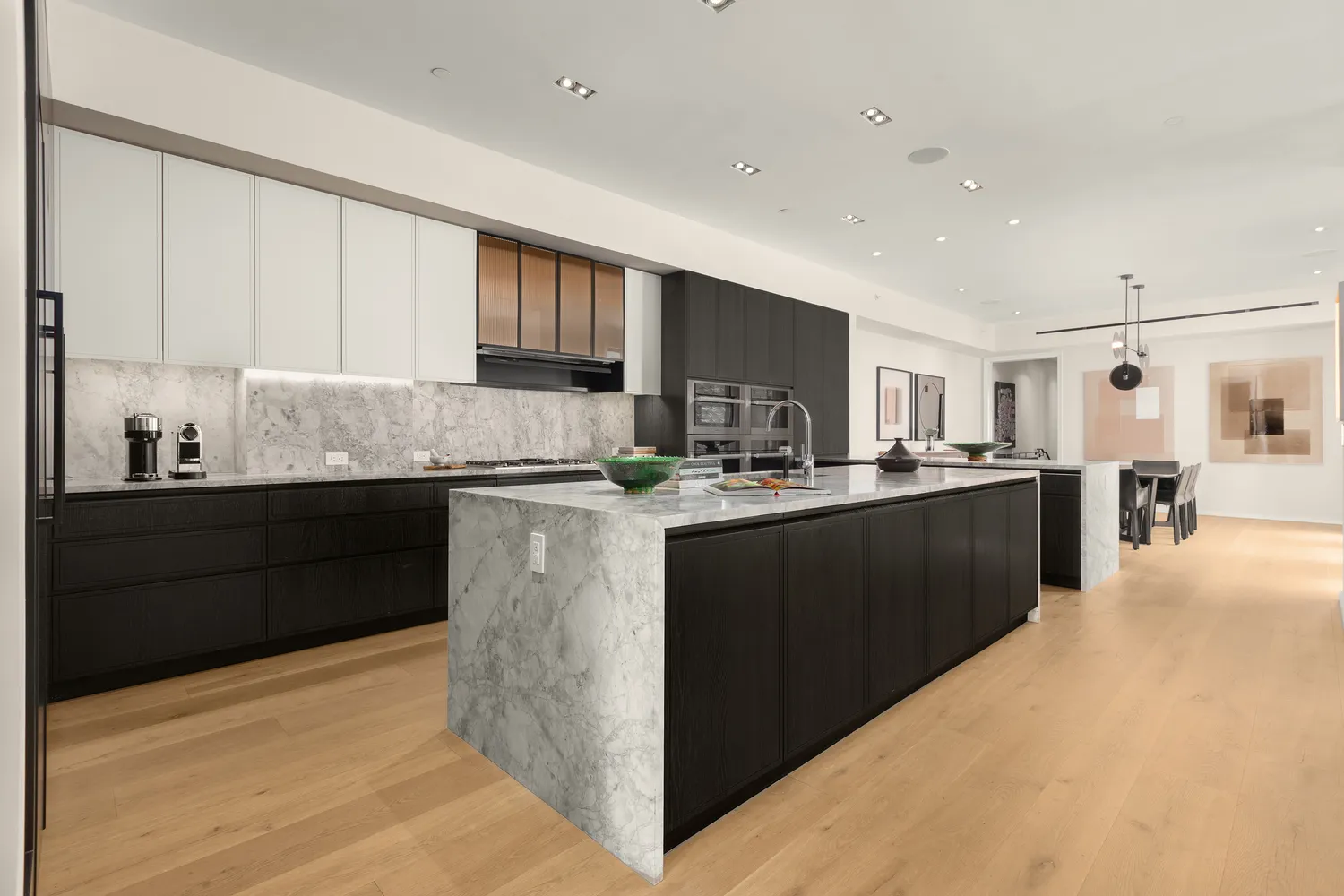 a kitchen with stainless steel appliances granite countertop a refrigerator a sink dishwasher and a stove with wooden cabinets