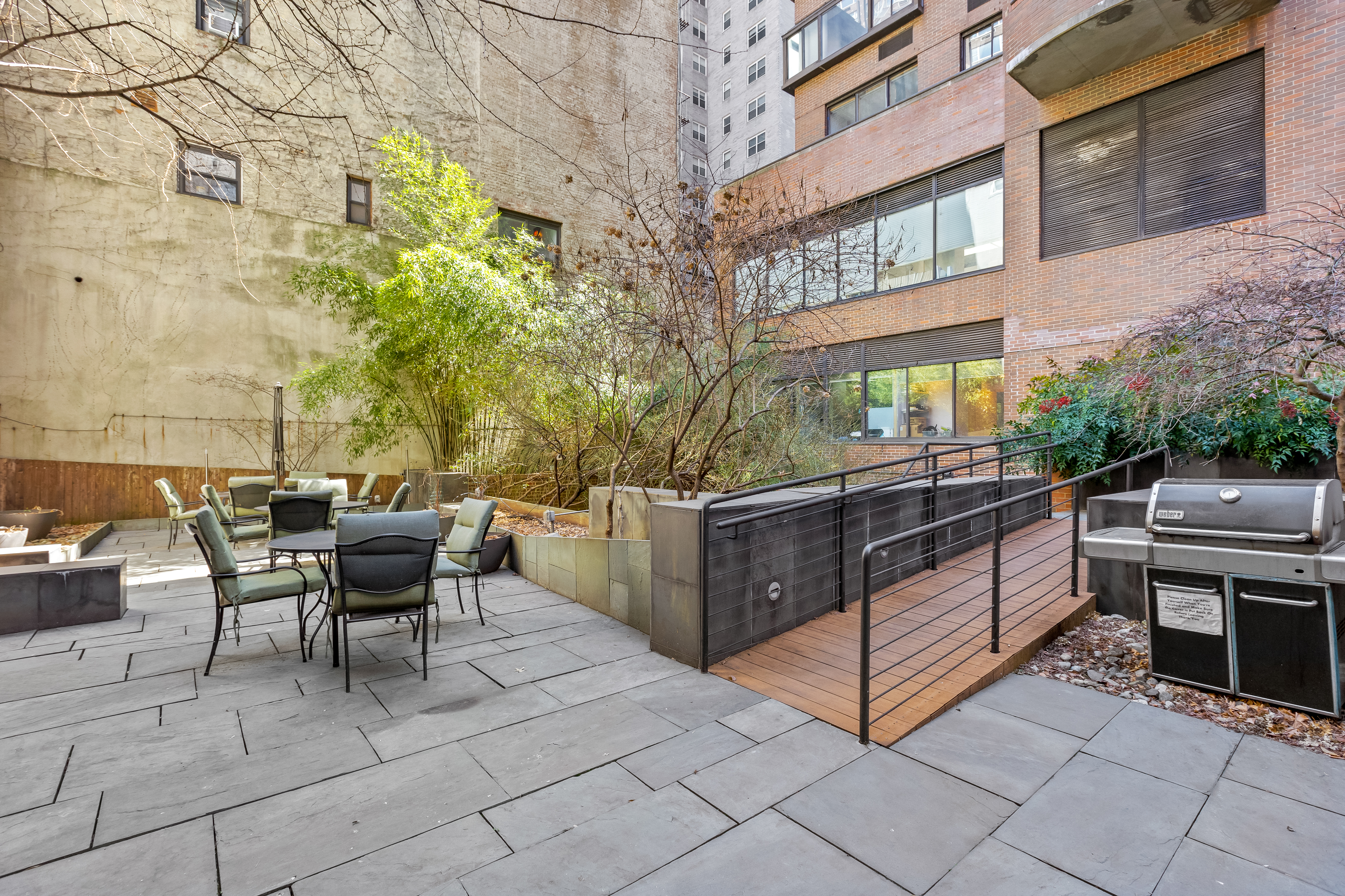 157 East 32nd Street, Unit 8A Manhattan, NY 10016 - Photo 13 of 16 a view of a patio with a table and chairs