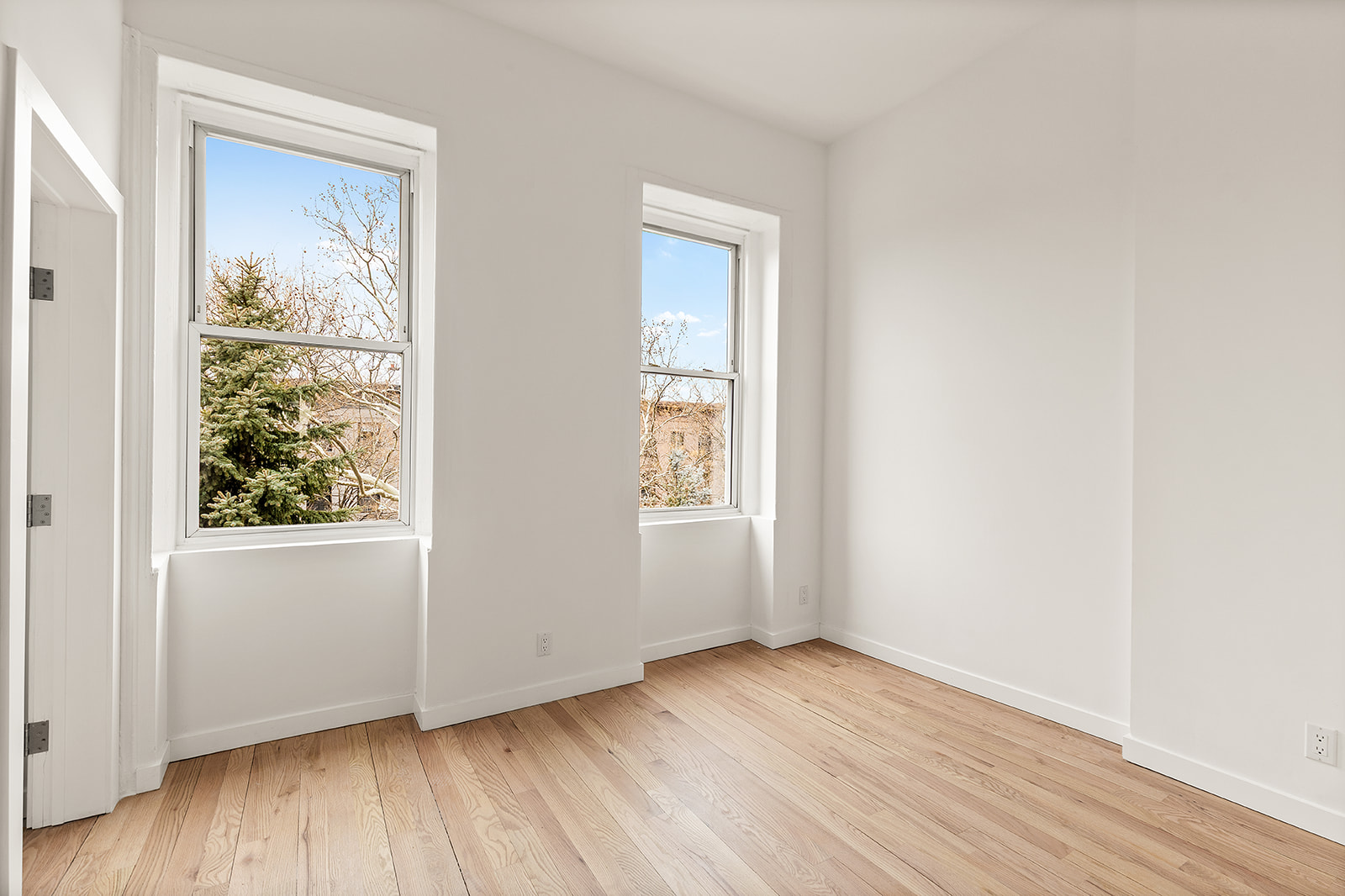 109 2nd Place Brooklyn, NY 11231 - Photo 17 of 26 an empty room with wooden floor and windows