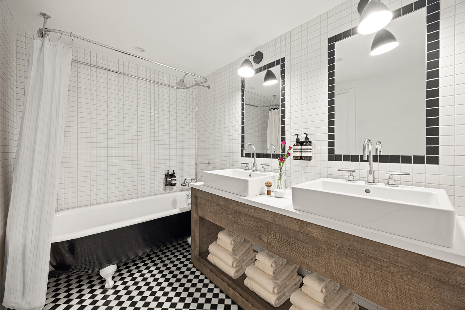 125 Rutland Road Brooklyn, NY 11225 - Photo 13 of 22 a bathroom with a large tub sink shower and a mirror