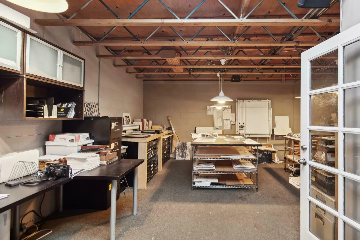 a view of a room with furniture and a chandelier