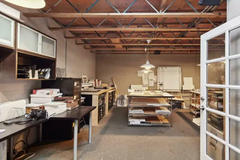 a view of a room with furniture and a chandelier