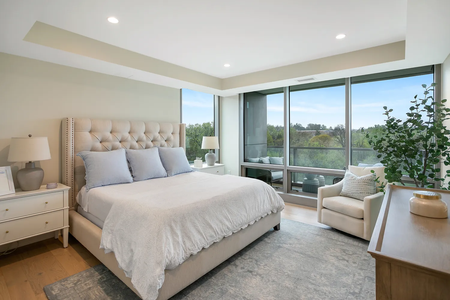 a large bedroom with a large bed and a large window