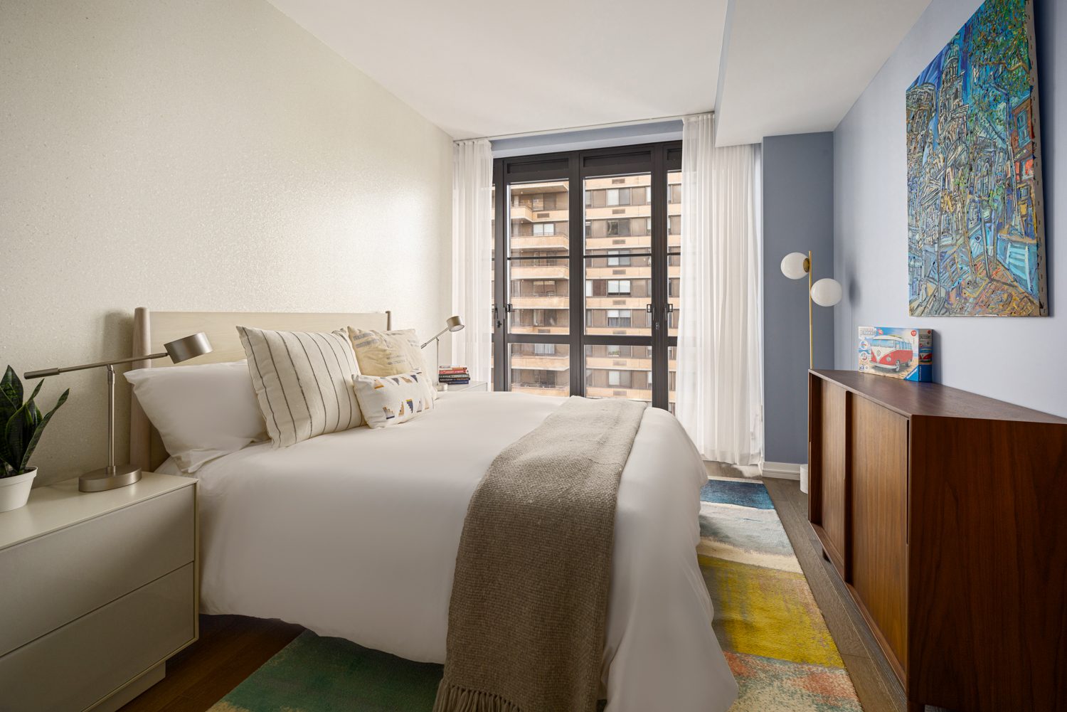 250 West 96th Street, Unit 12B Manhattan, NY 10025 - Photo 7 of 26 a bedroom with a bed and a large window