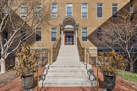 a front view of a building with street view
