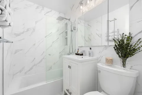 a bathroom with a sink a toilet and a bathtub