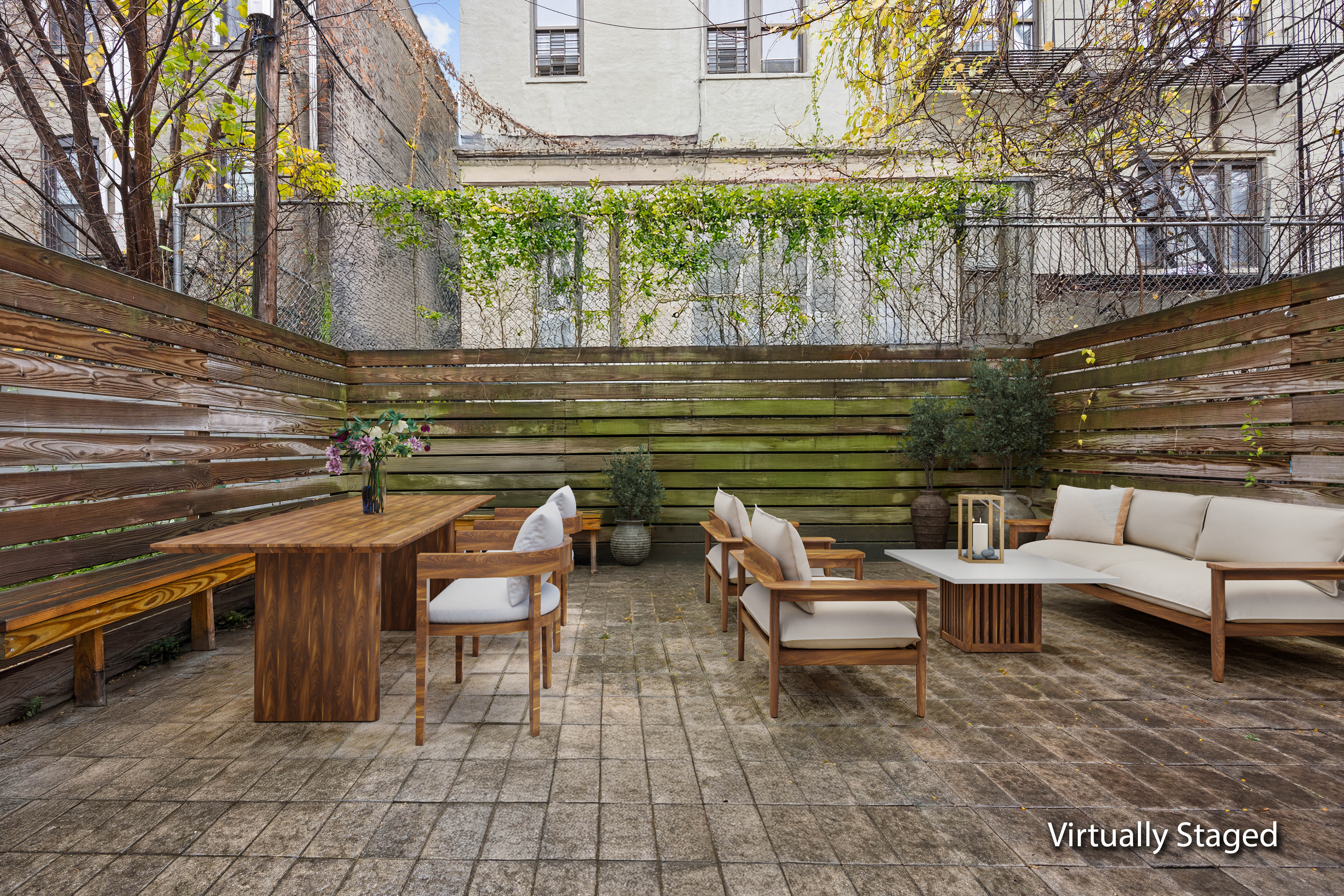 750 Lincoln Place Brooklyn, NY 11216 - Photo 19 of 24 a backyard of a house with outdoor seating