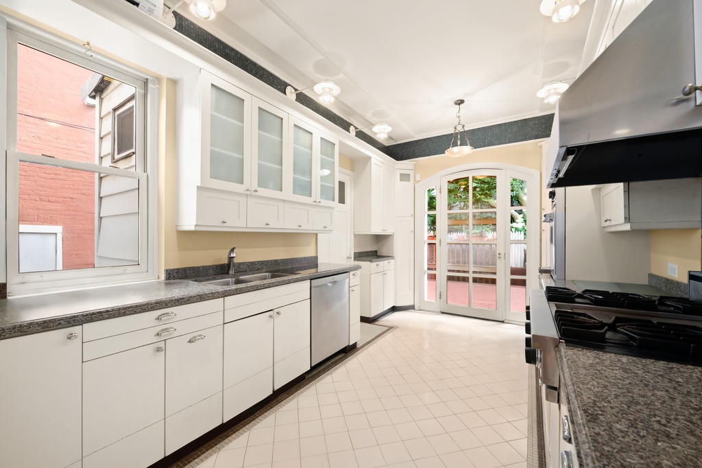 524 3rd Street Brooklyn, NY 11215 - Photo 3 of 18 a kitchen with stainless steel appliances granite countertop a sink and a stove
