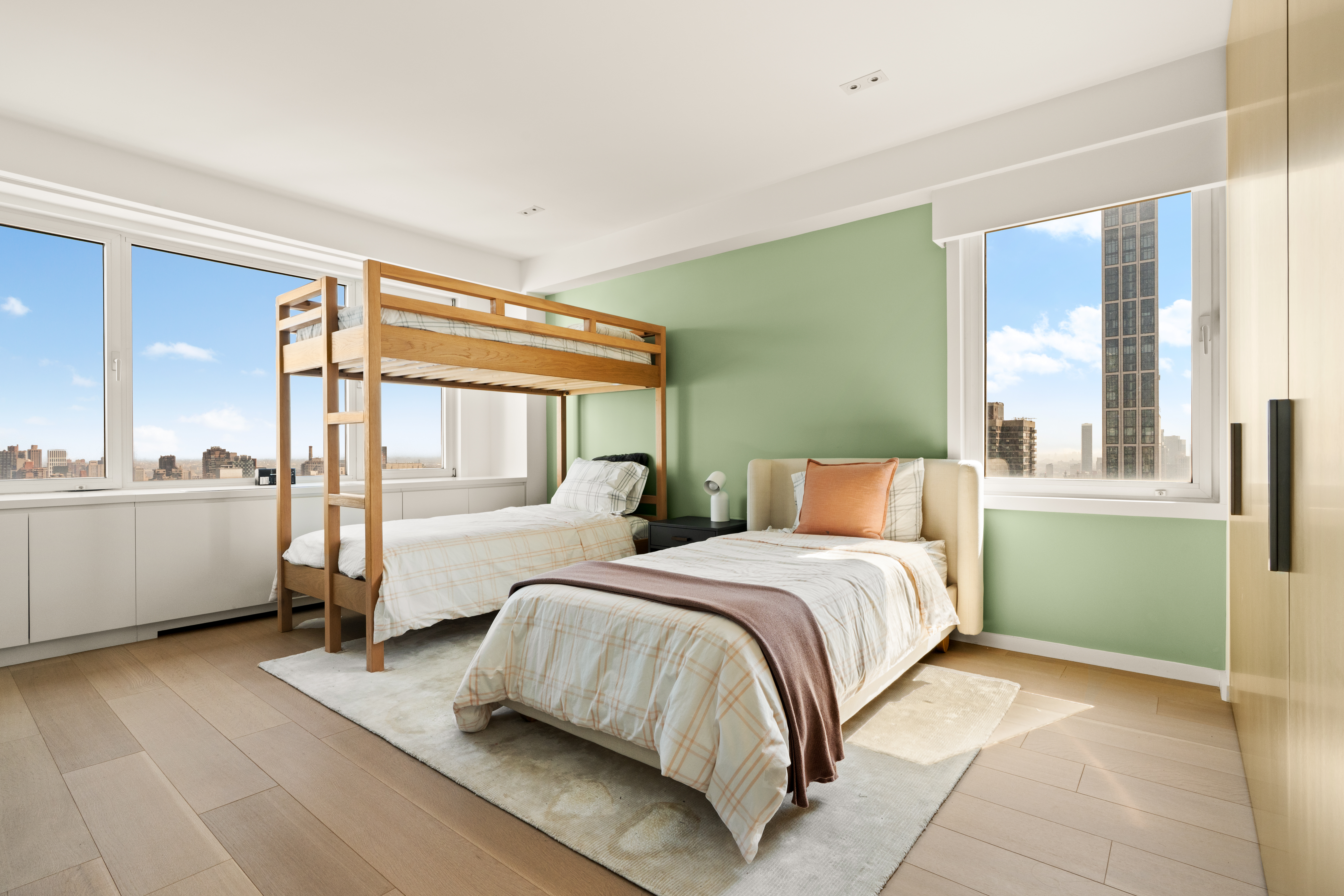 303 East 57th Street, Unit 44G Manhattan, NY 10022 - Photo 12 of 19 a bedroom with a large bed and a large window