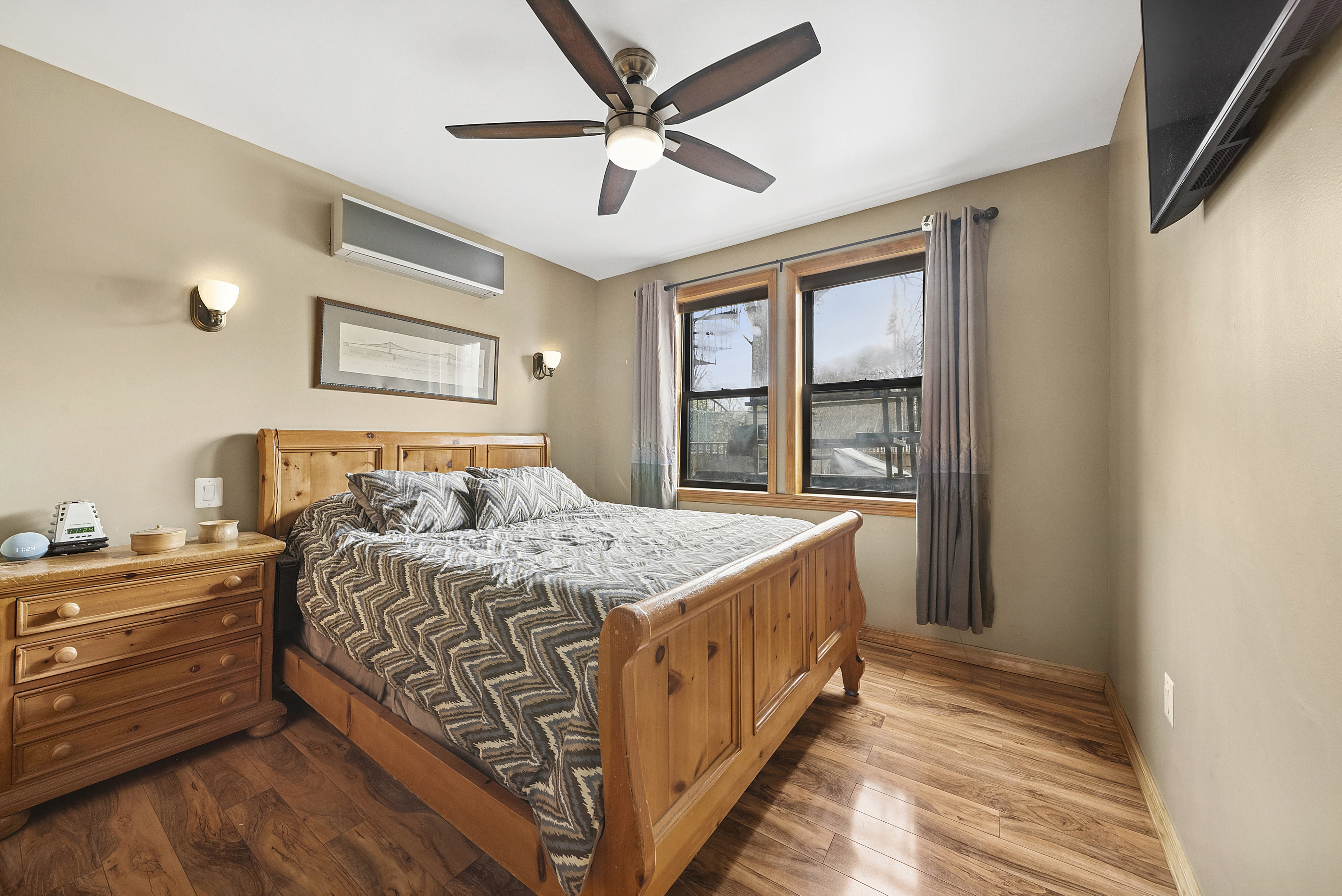 203 Battery Avenue Brooklyn, NY 11209 - Photo 5 of 14 a bedroom with a bed and a window