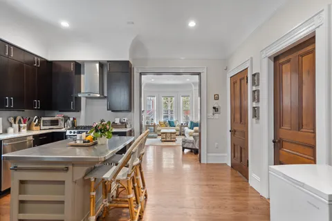 a kitchen with a sink appliances and cabinets