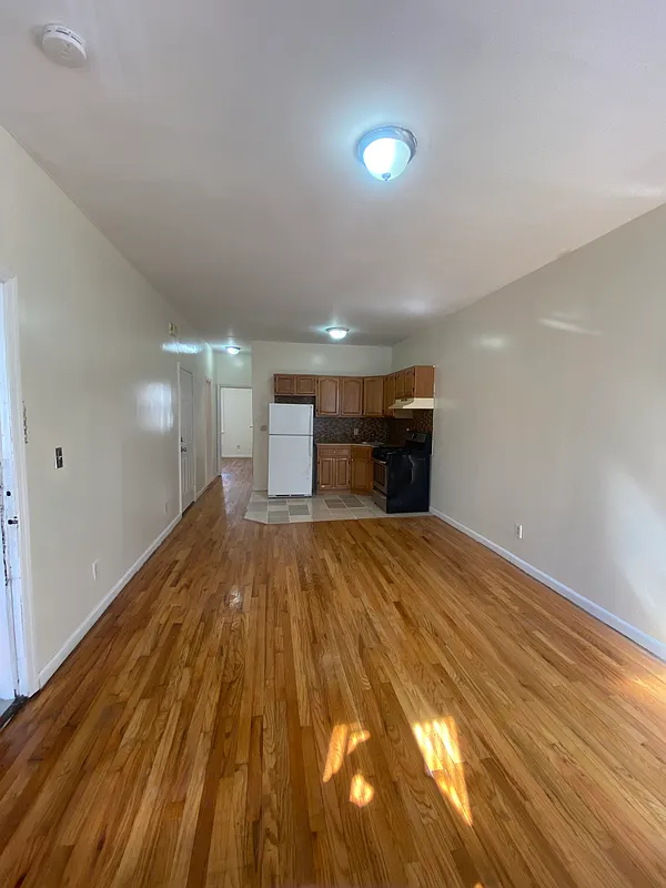 1251 Saint Marks Avenue, Unit 2 Brooklyn, NY 11213 - Photo 1 of 5 a view of empty room with wooden floor