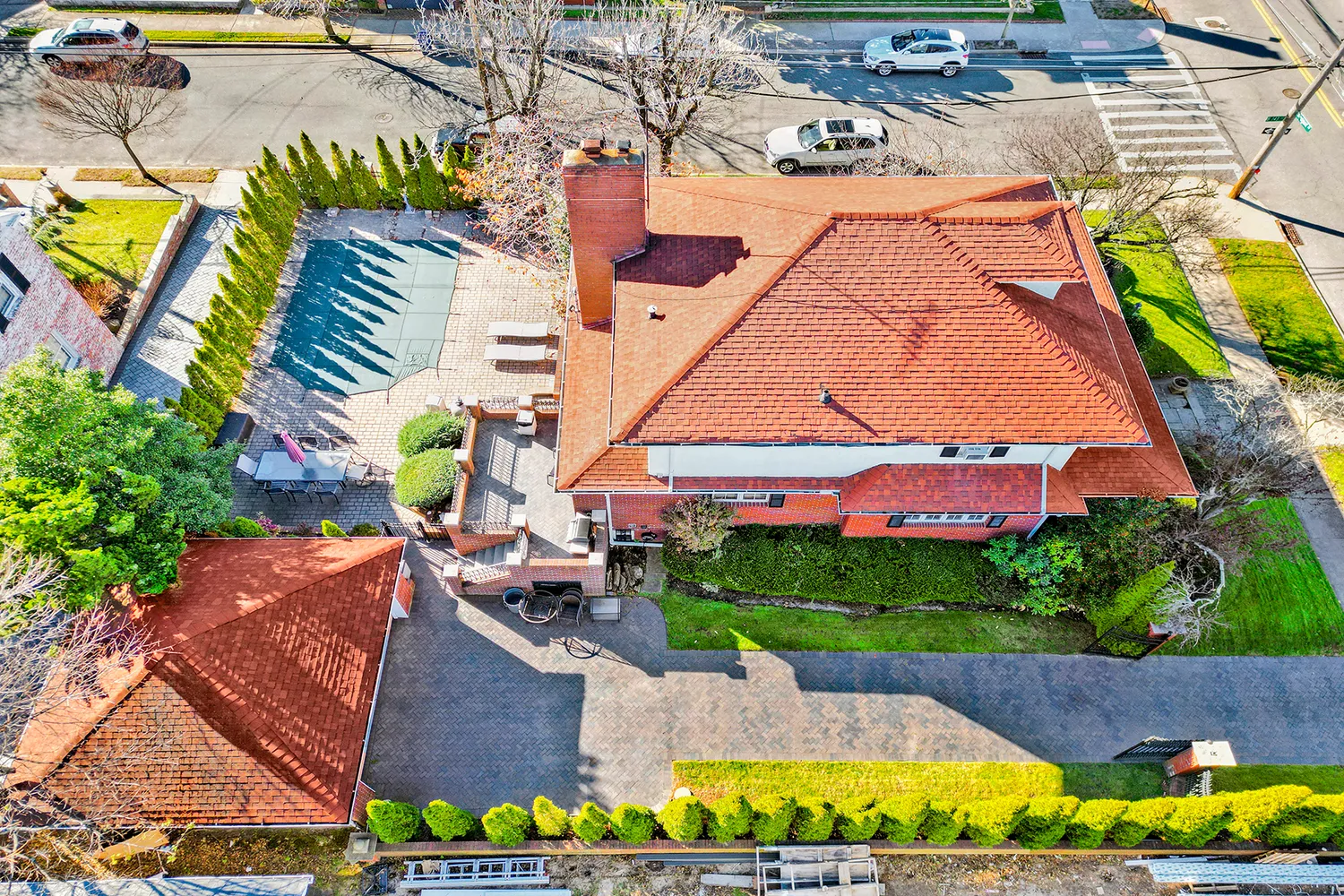 a front view of building with cars parked