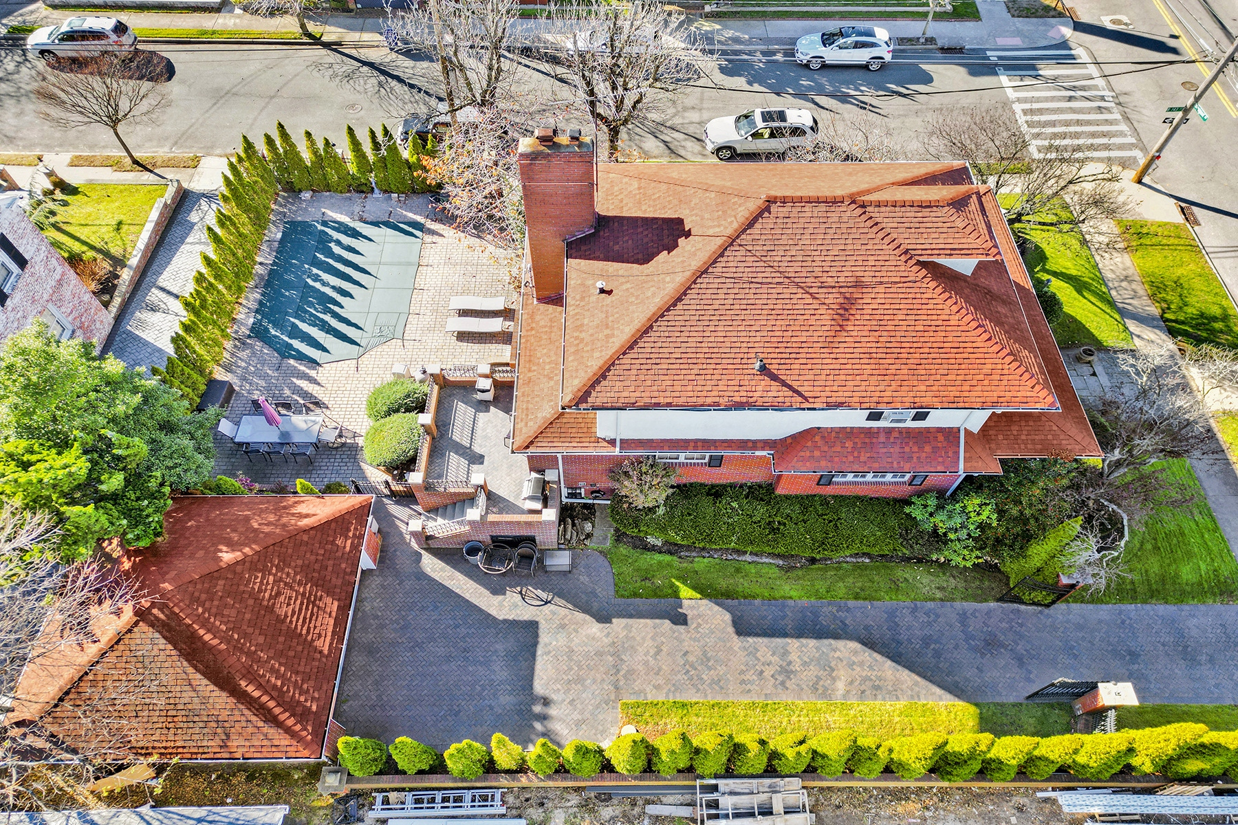 142-15 Newport Avenue Queens, NY 11694 - Photo 47 of 72 an aerial view of a house with a garden and swimming pool