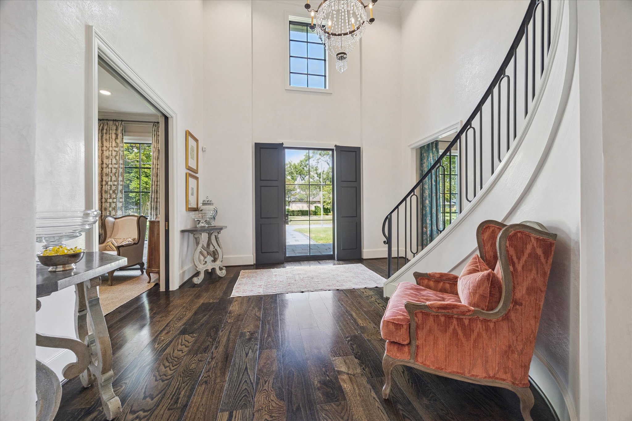 310 Longwoods Lane Houston, TX 77024 - Photo 5 of 49 a living room with furniture stairs and a wooden floor