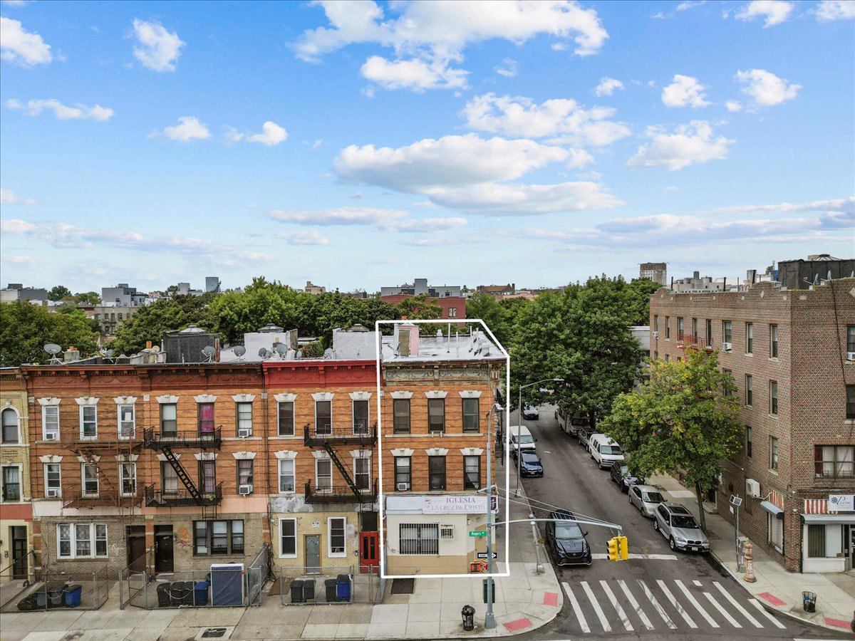 1056 Rogers Avenue Brooklyn, NY 11226 - Photo 3 of 9 a front view of a multi story building with a yard
