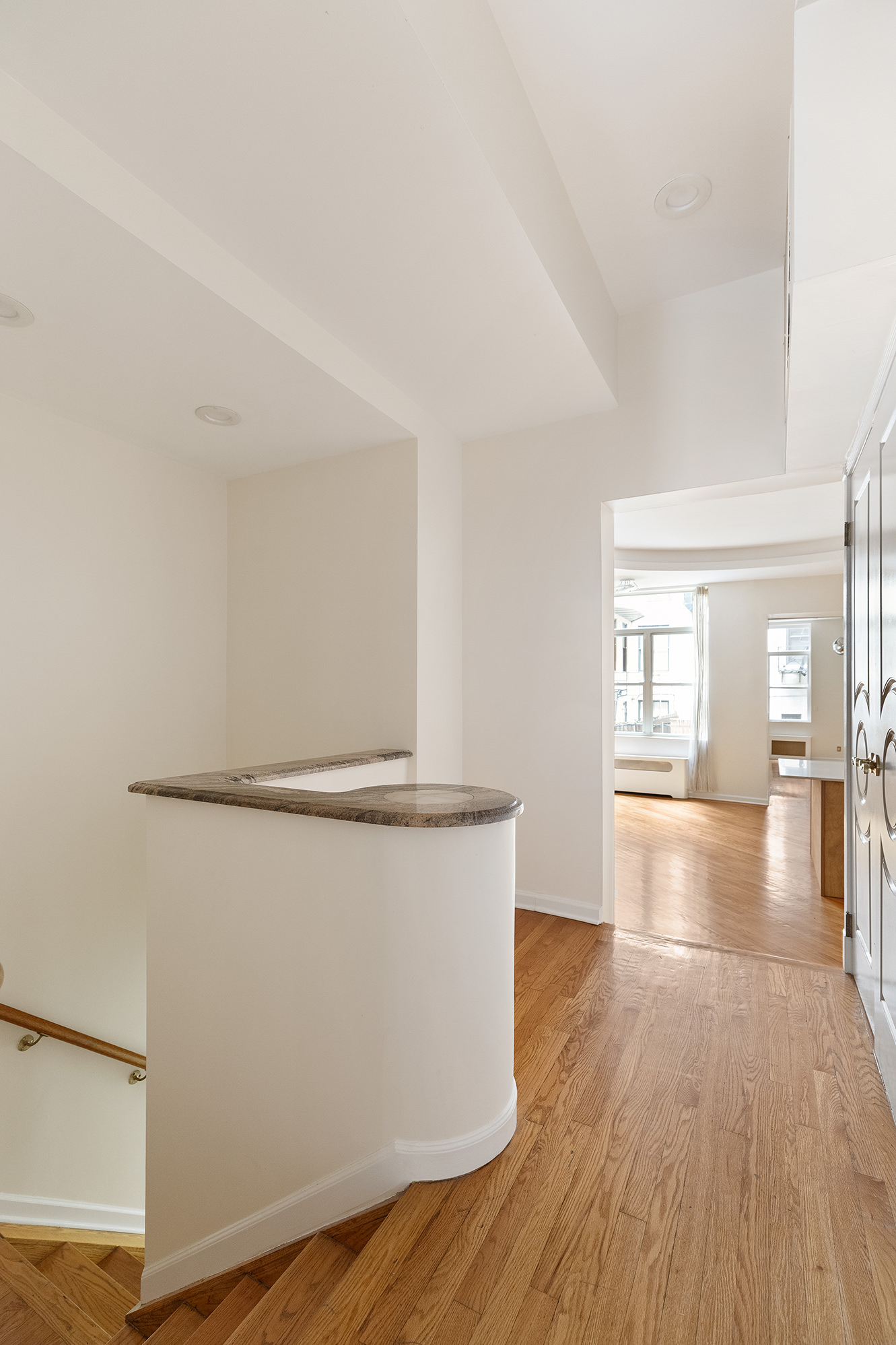 23 East 81st Street, Unit 1 Manhattan, NY 10028 - Photo 1 of 23 a view of empty room with wooden floor and fan