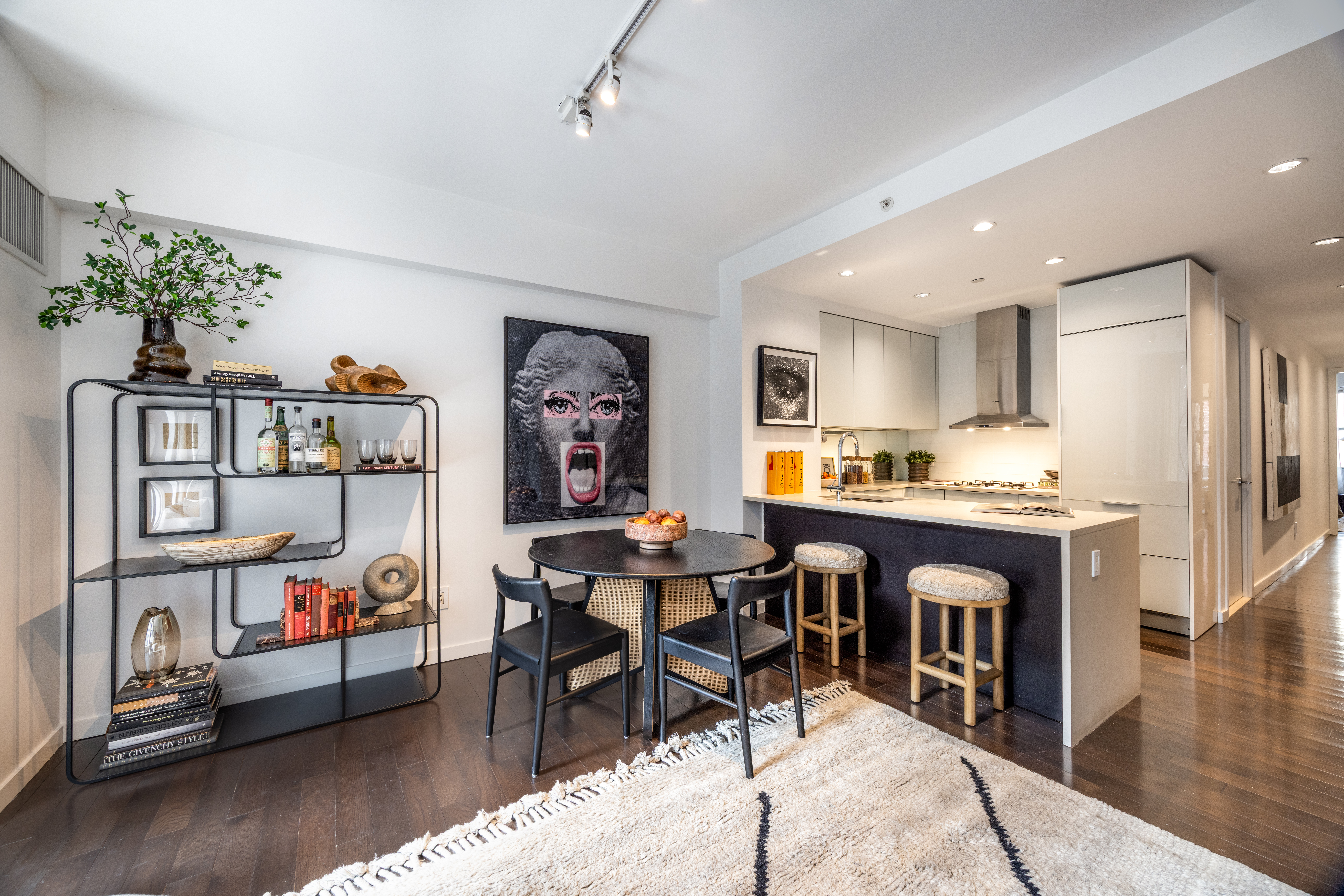27 West 19th Street, Unit 6 Manhattan, NY 10011 - Photo 3 of 10 a view of a dining room with furniture and a kitchen
