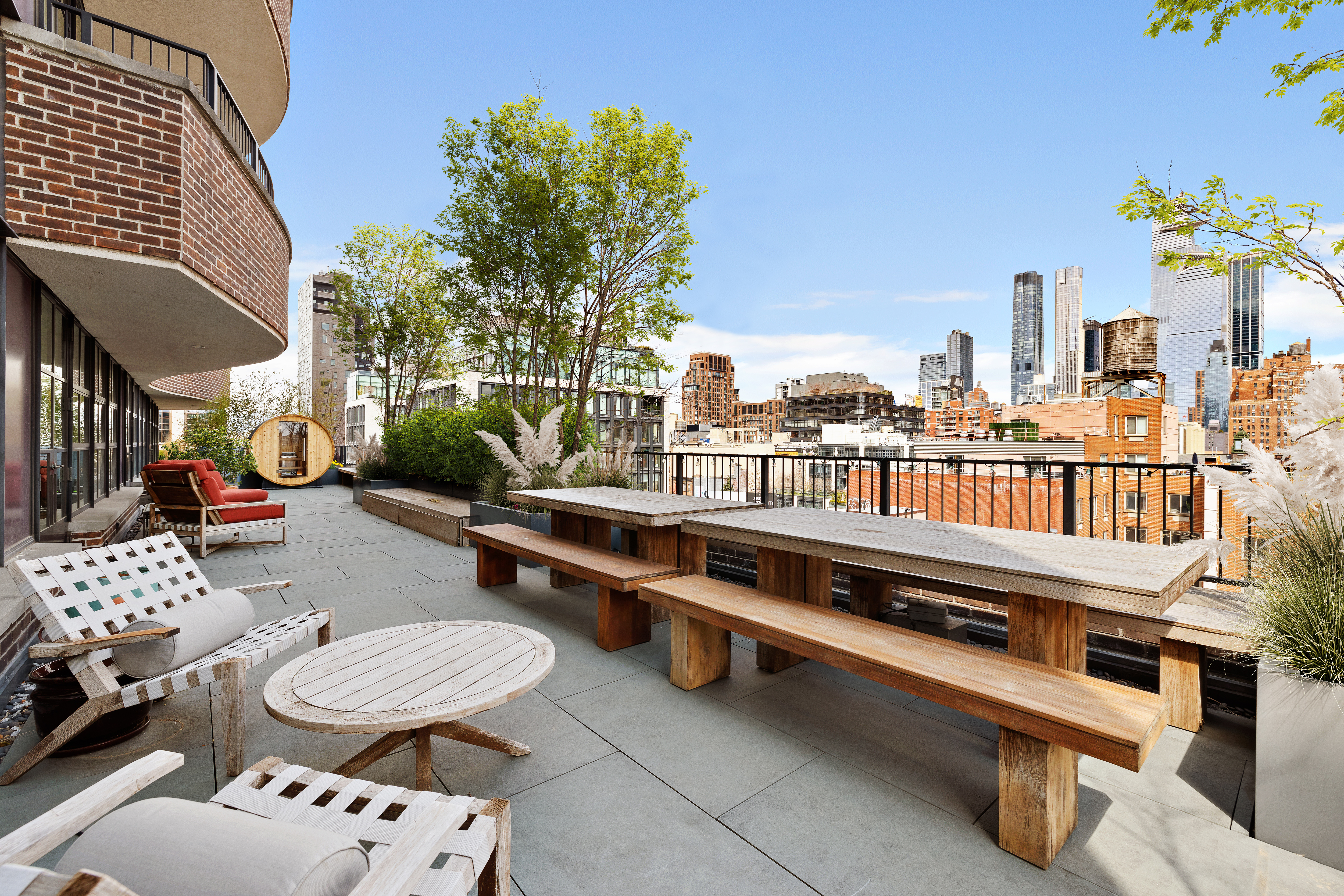 456 West 19th Street, Unit PHG Manhattan, NY 10011 - Photo 10 of 12 a roof deck with couches and wooden floor