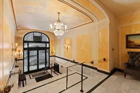 a view of a livingroom with furniture and windows