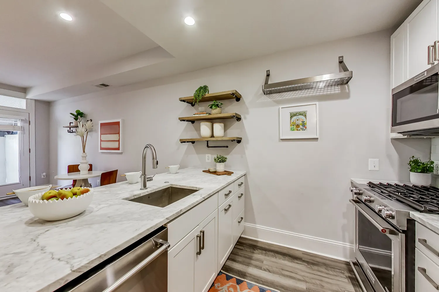 a kitchen with a sink and stove