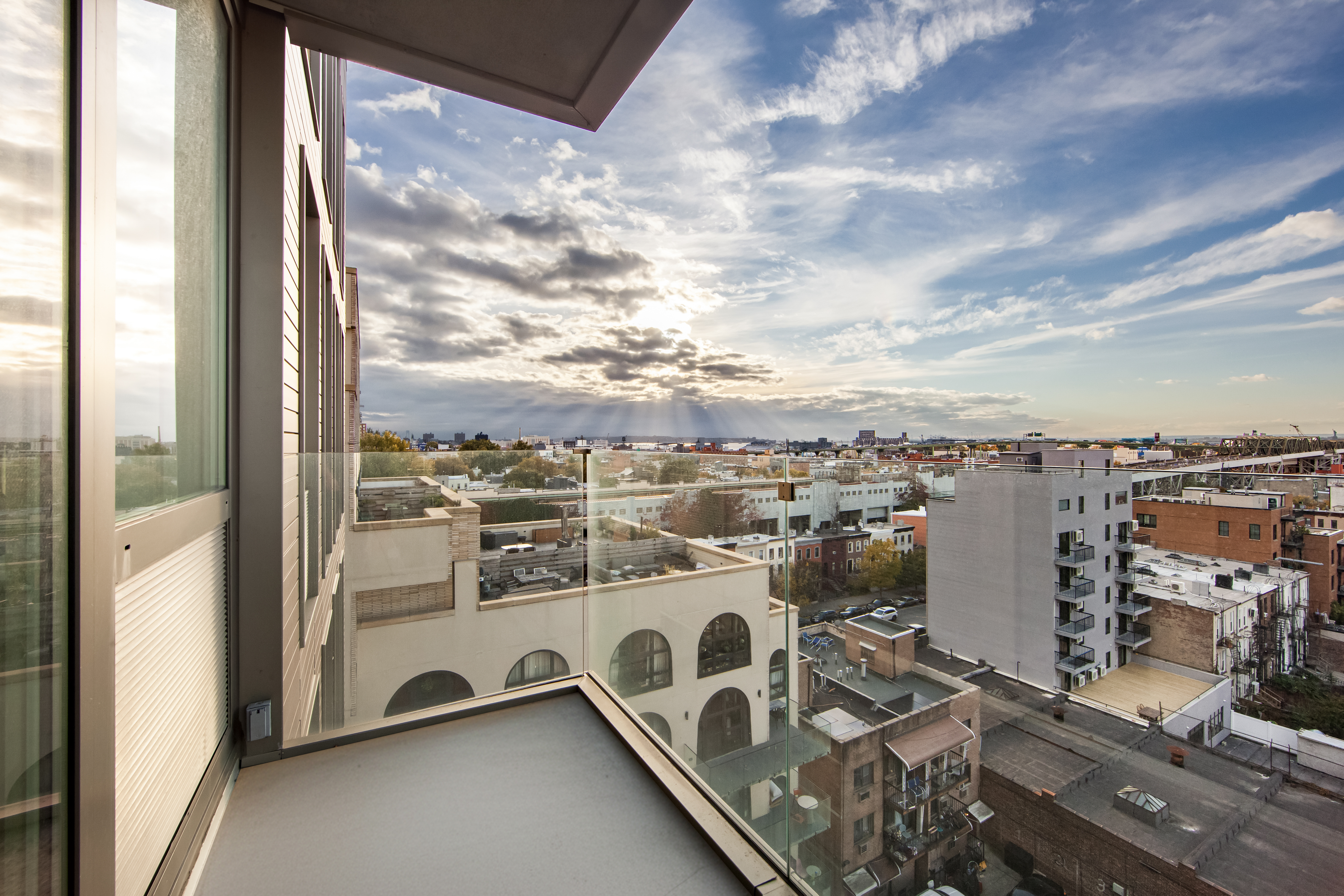 202 8th Street, Unit 8B Brooklyn, NY 11215 - Photo 6 of 20 a view of a terrace with wooden floor and city view