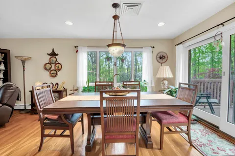 a view of a dining room with furniture window and outside view