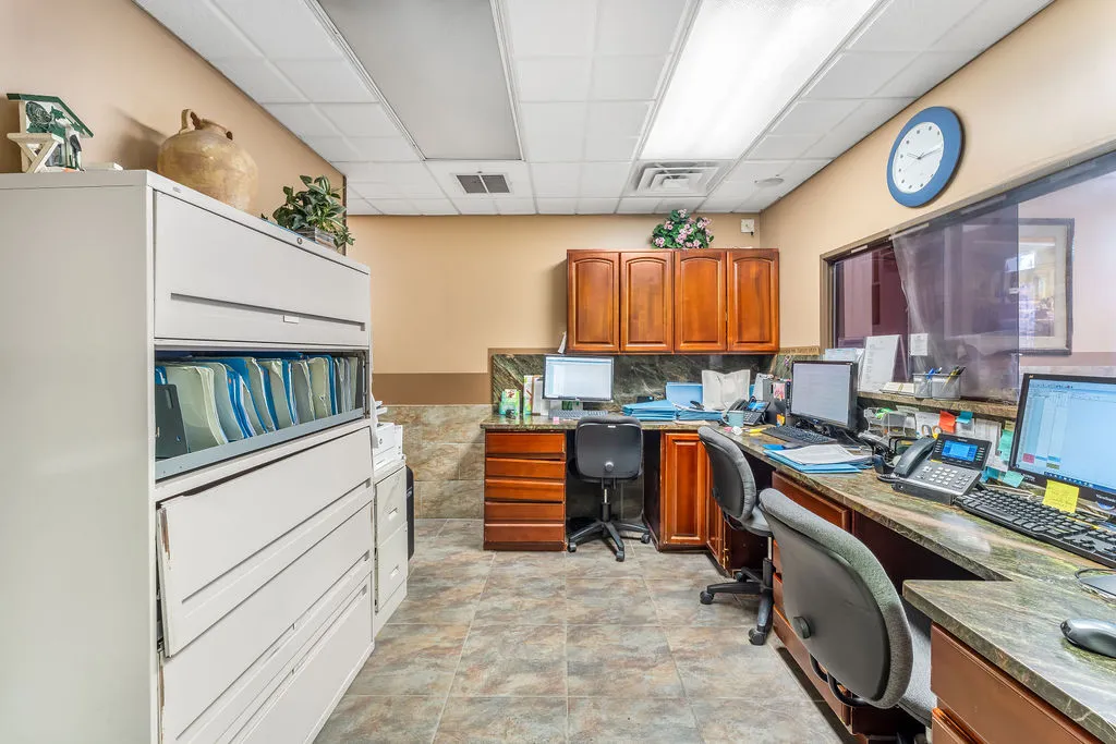 a room with furniture a rug and a window