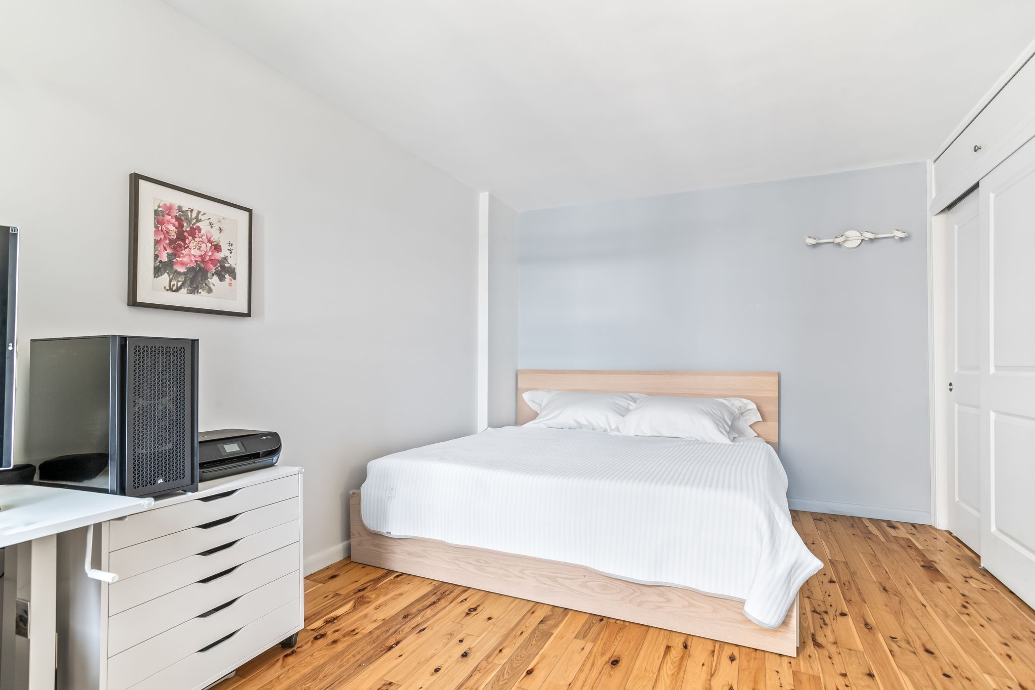 900 West 190th Street, Unit 11J Manhattan, NY 10040 - Photo 7 of 15 a bedroom with a bed and a flat tv screen on dresser