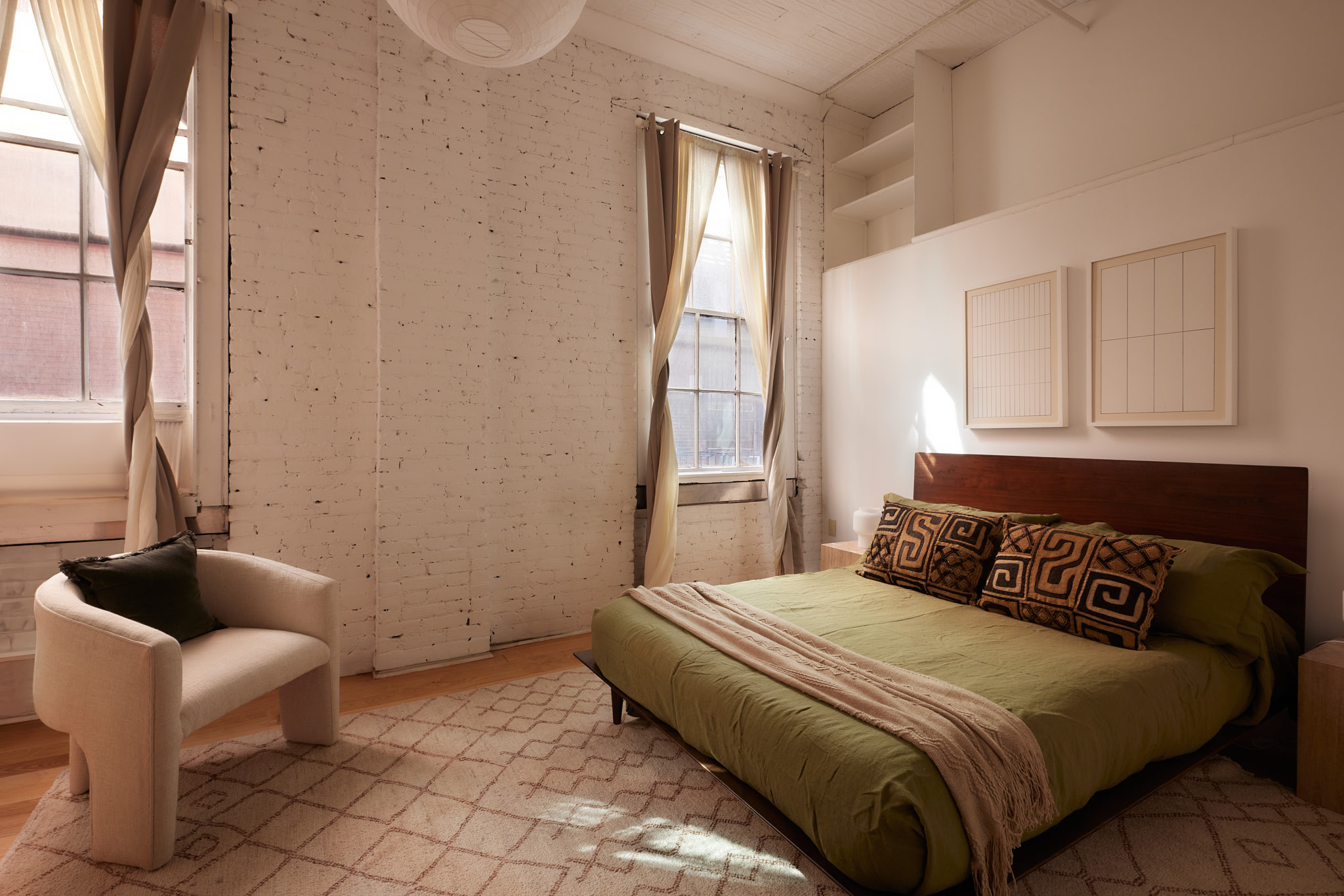 2 Bond Street, Unit 2 Manhattan, NY 10012 - Photo 13 of 16 a bedroom with a bed and a couch