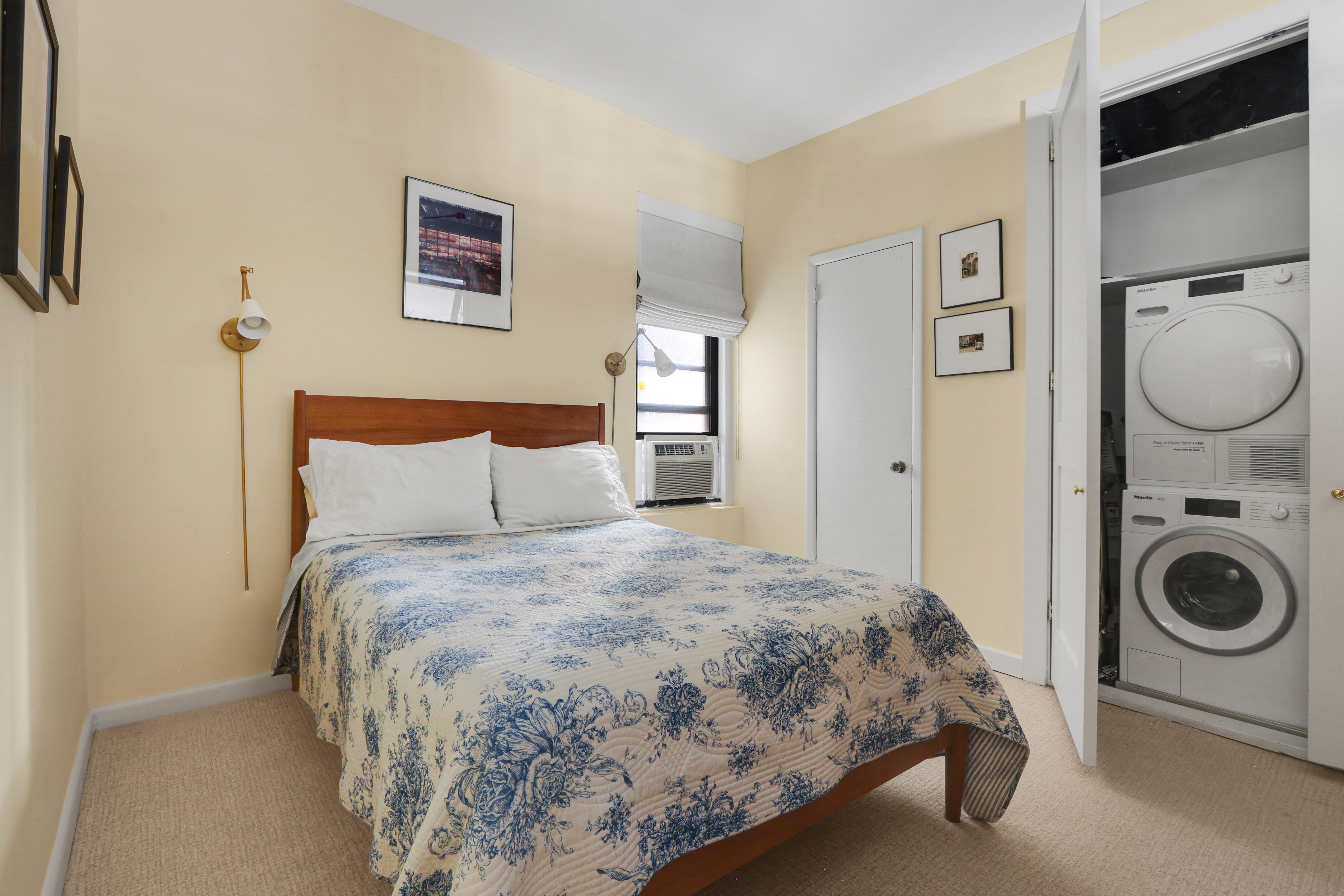 311 West 97th Street, Unit 6E Manhattan, NY 10025 - Photo 13 of 18 a bedroom with a bed and a view of bathroom