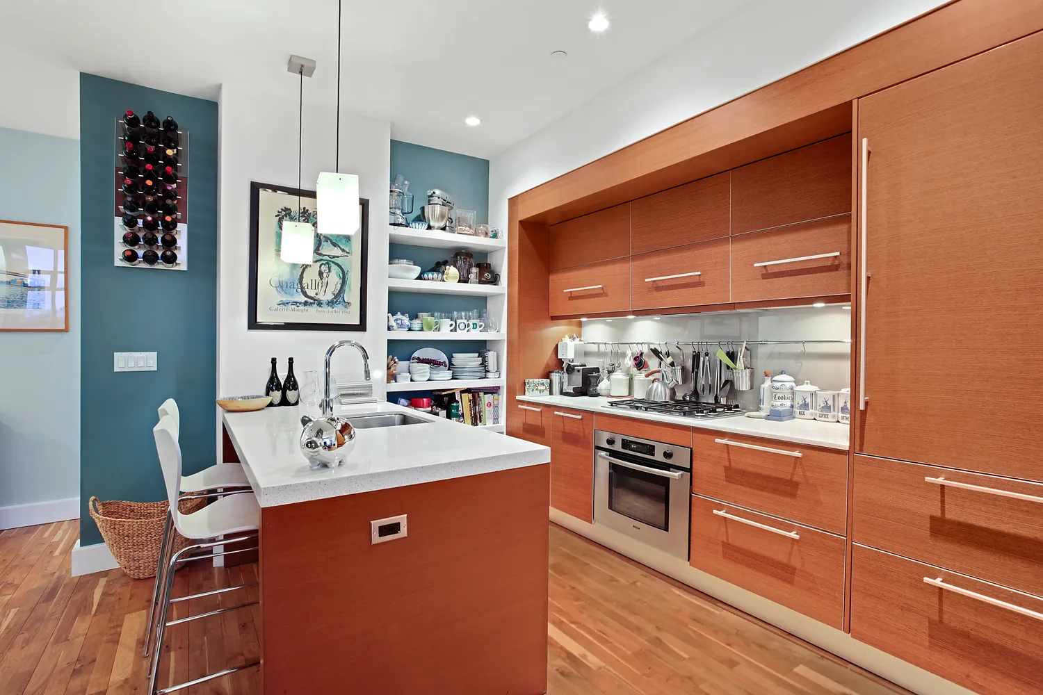 a kitchen with stainless steel appliances kitchen island granite countertop a sink and wooden cabinets