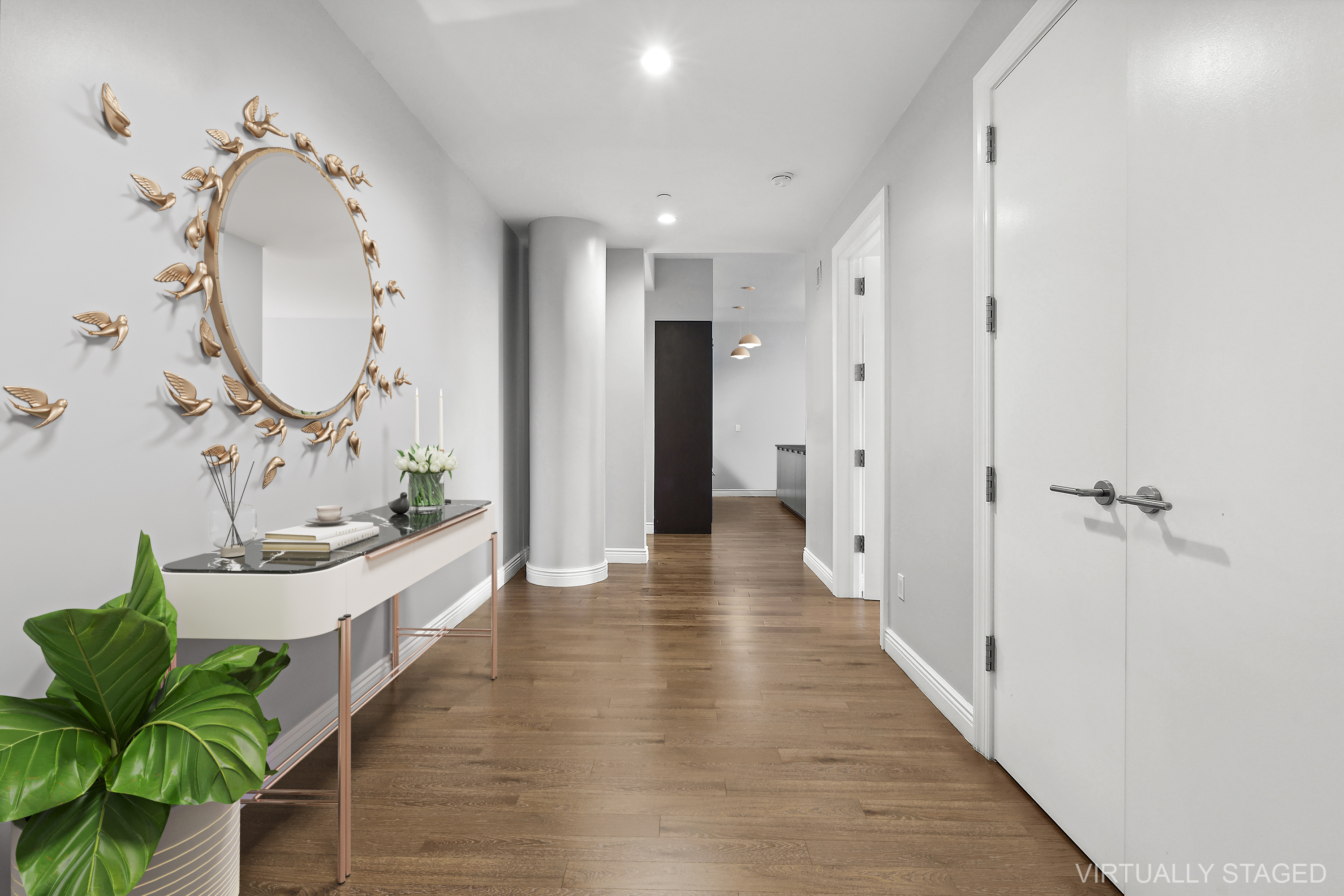 225 5th Avenue, Unit 7K Manhattan, NY 10010 - Photo 5 of 14 a view of a hallway with wooden floor windows and a chandelier