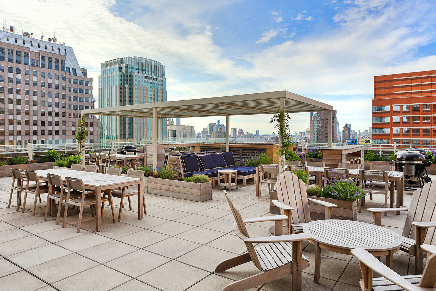 365 Bridge Street, Unit 8L Brooklyn, NY 11201 - Photo 7 of 21 a view of a patio with a dining table and chairs