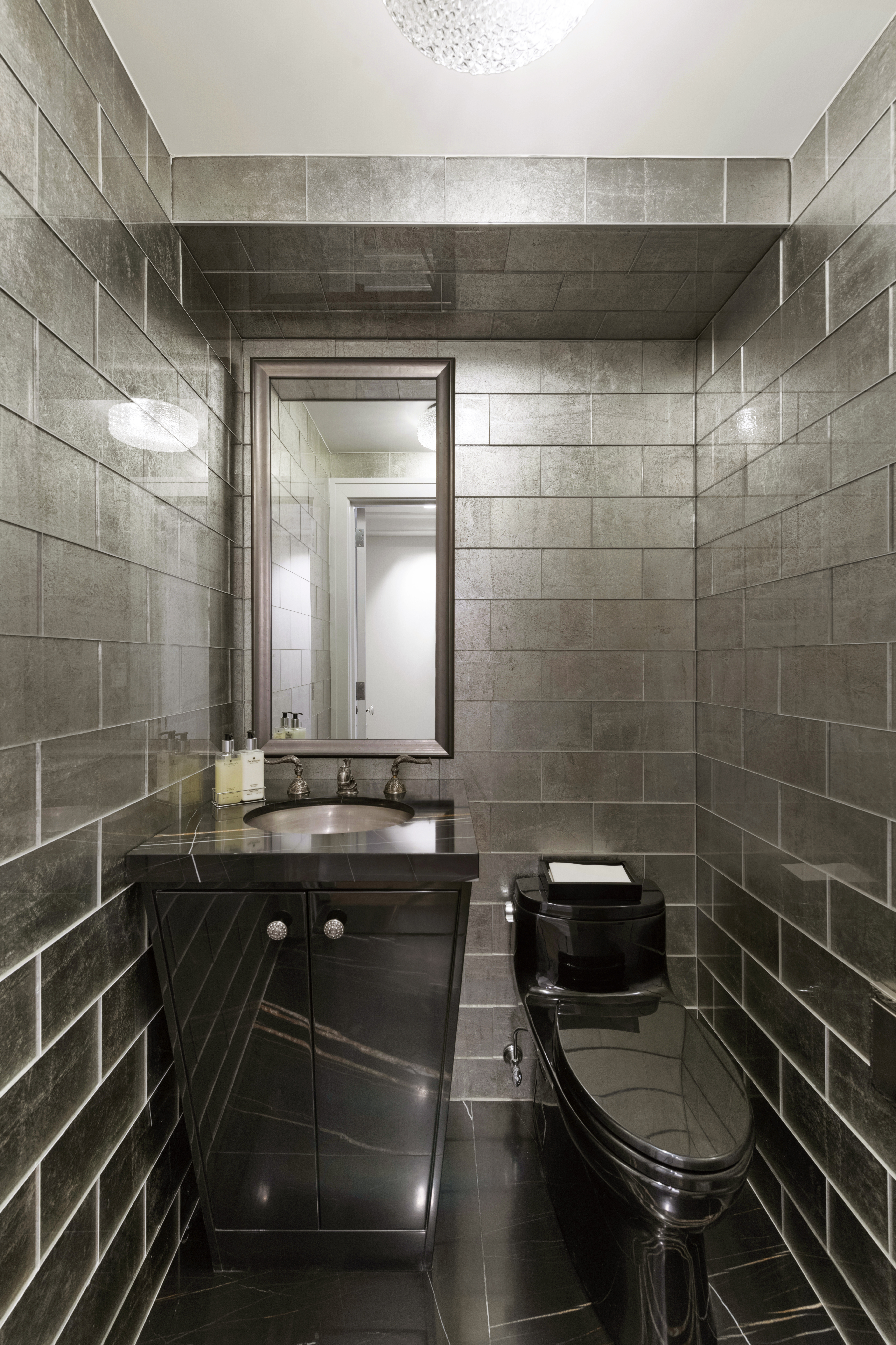 180 East End Avenue, Unit 15E Manhattan, NY 10128 - Photo 20 of 31 a bathroom with a sink and a mirror
