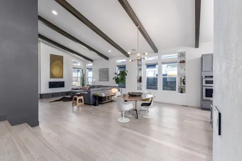 a kitchen with kitchen island granite countertop a sink stainless steel appliances and cabinets