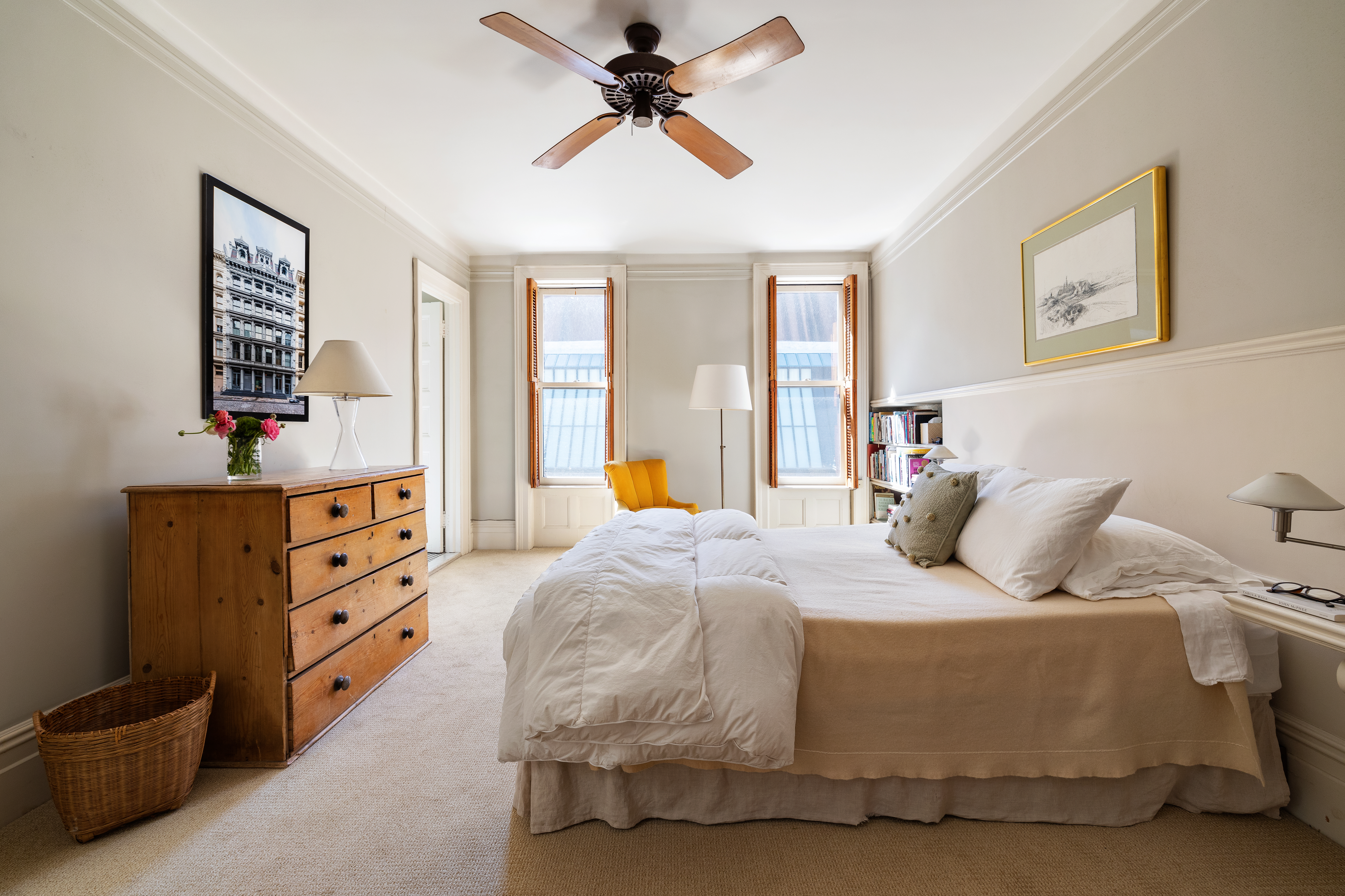 26 Pierrepont Street, Unit 2 Brooklyn, NY 11201 - Photo 12 of 21 a bedroom with a bed and a chandelier