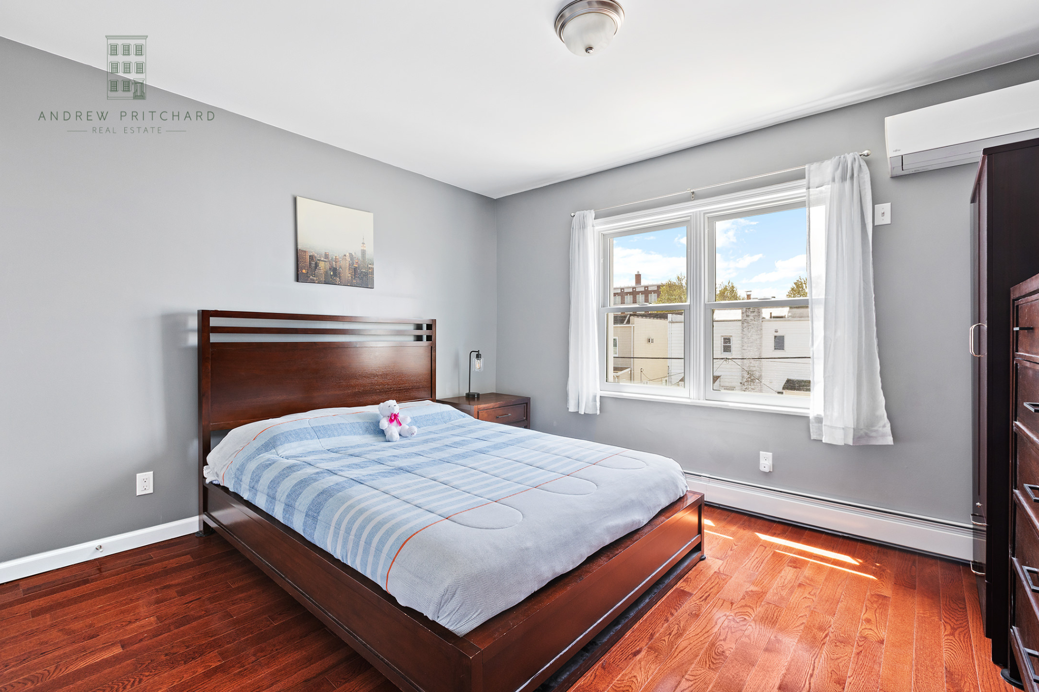 1140 78th Street Brooklyn, NY 11228 - Photo 7 of 12 a bedroom with a bed and window