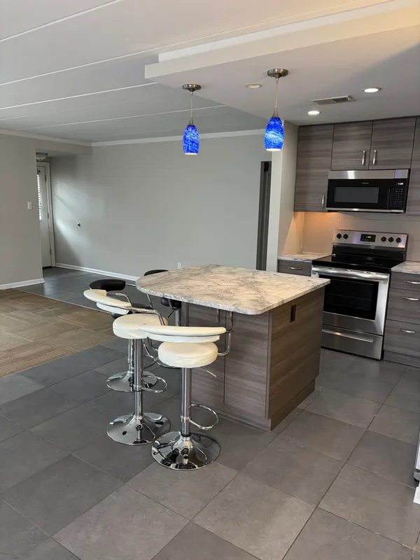 a room with furniture and a projector screen