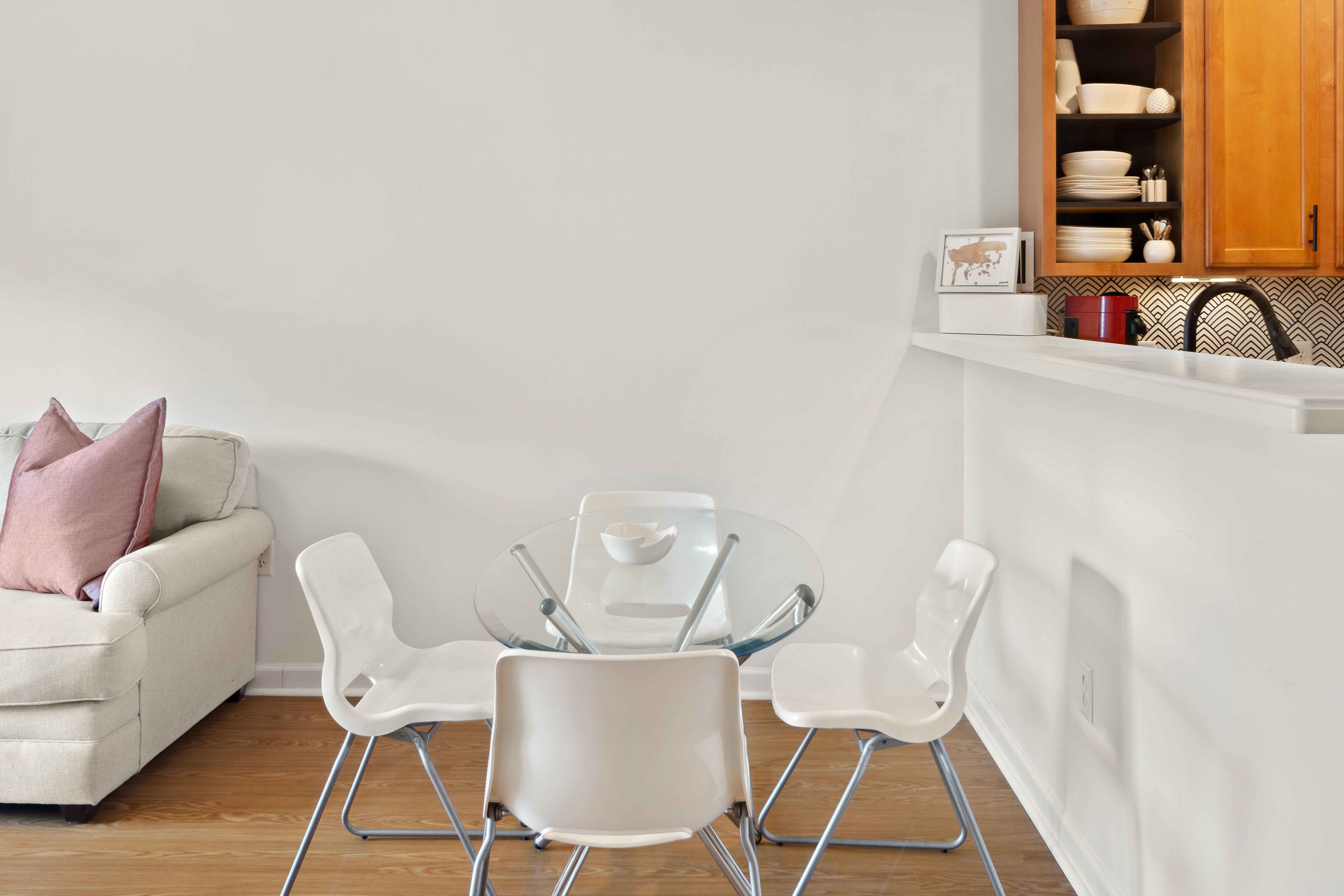 107 Clocktower Drive, Unit 407 Waltham, MA 02452 - Photo 7 of 19 a view of a dining room with furniture and wooden floor