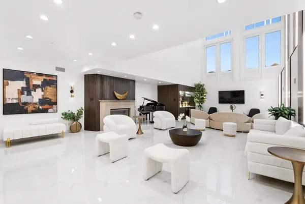a living room with furniture white walls and white walls