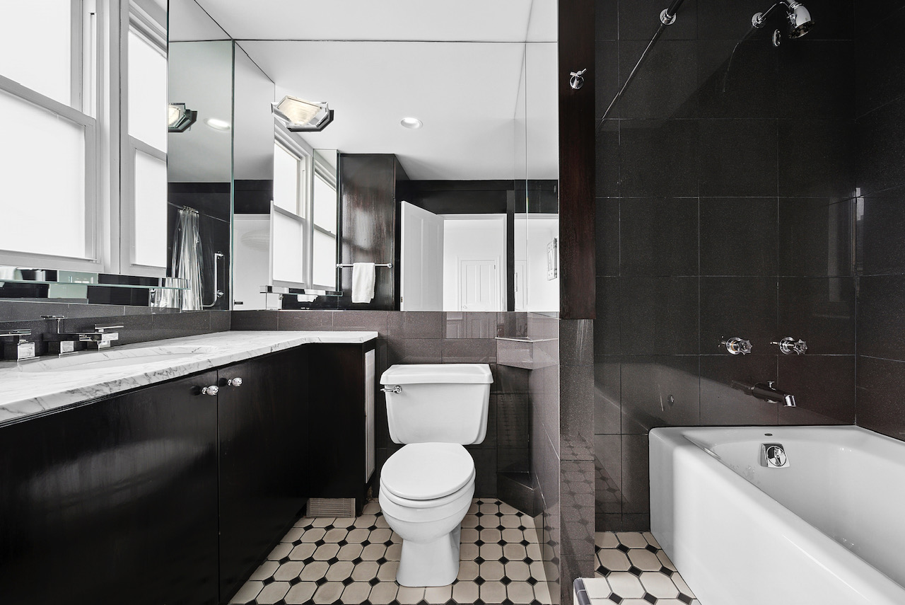 12 Beekman Place, Unit PHA Manhattan, NY 10022 - Photo 7 of 12 a bathroom with a sink a toilet and a mirror