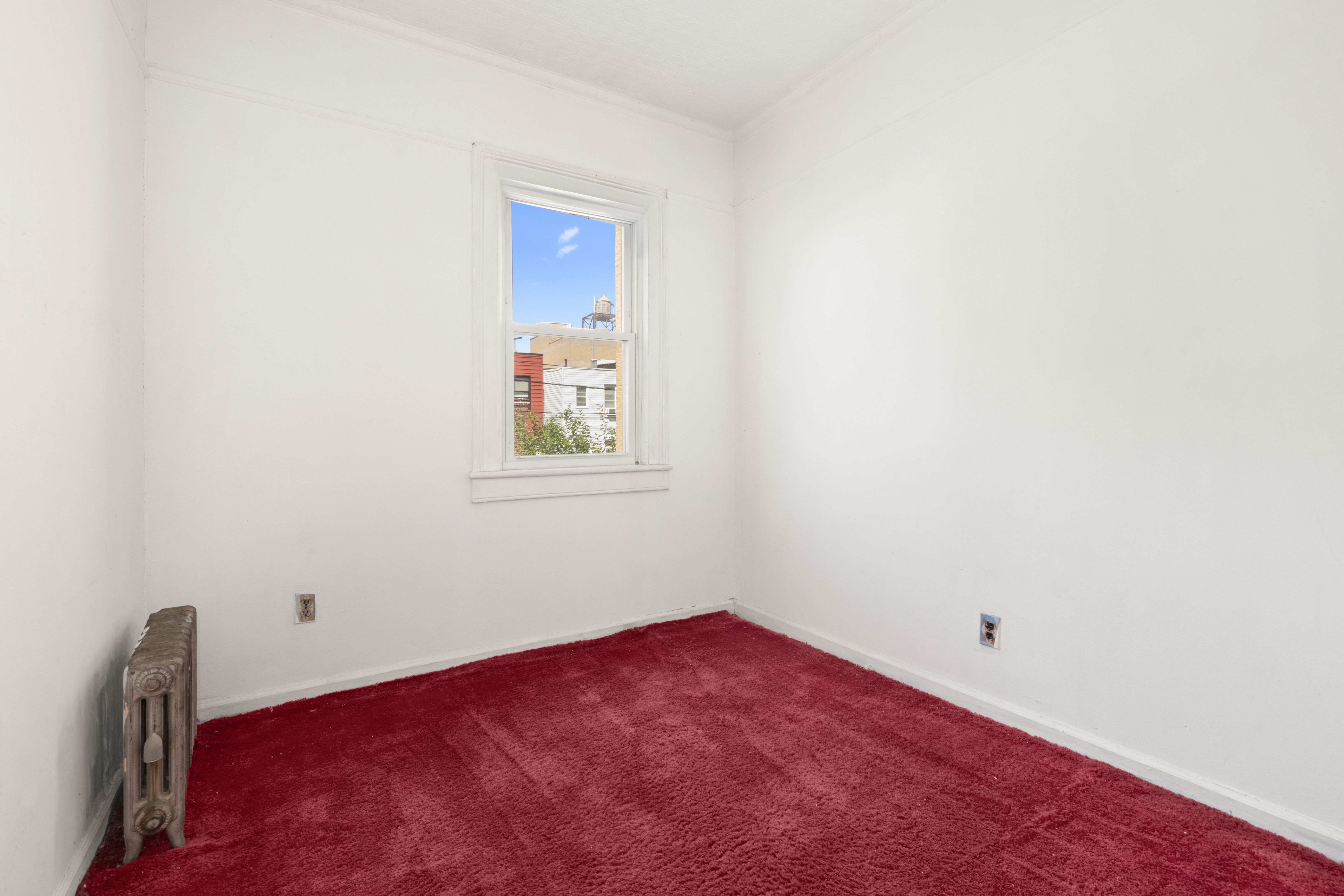 37-34 28th Street Queens, NY 11101 - Photo 16 of 17 a view of a room with a fan