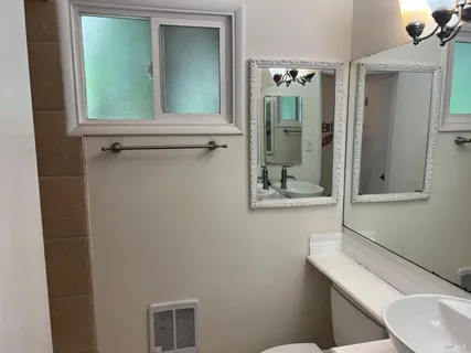 a view of balcony with wooden floor and potted plant