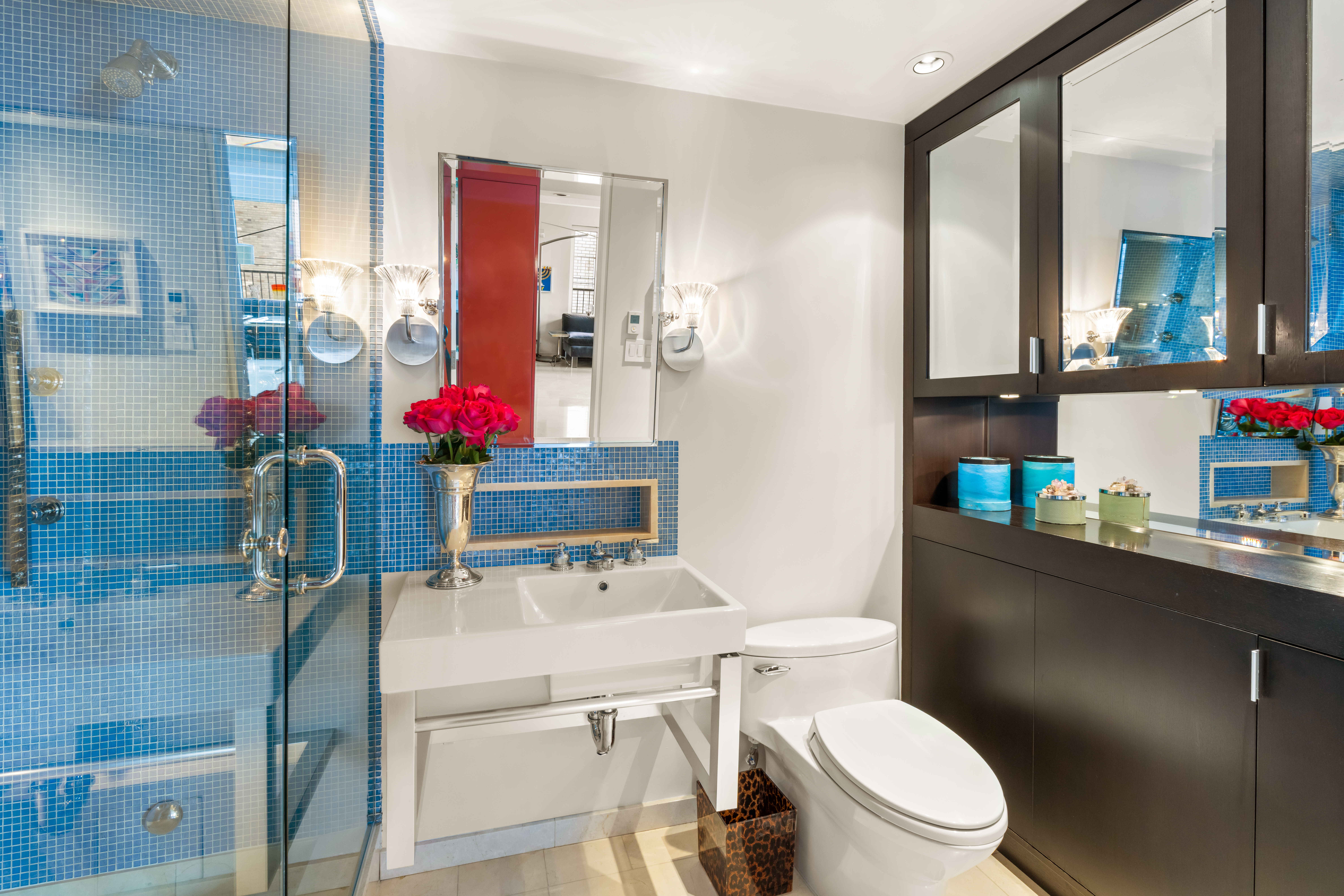 120 Central Park South, Unit PHE/W Manhattan, NY 10019 - Photo 5 of 11 a bathroom with a sink vanity mirror and toilet