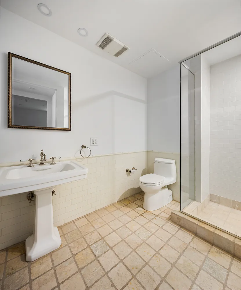 a bathroom with a sink toilet and vanity