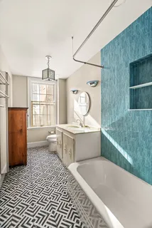 a room with a window and flowerpot