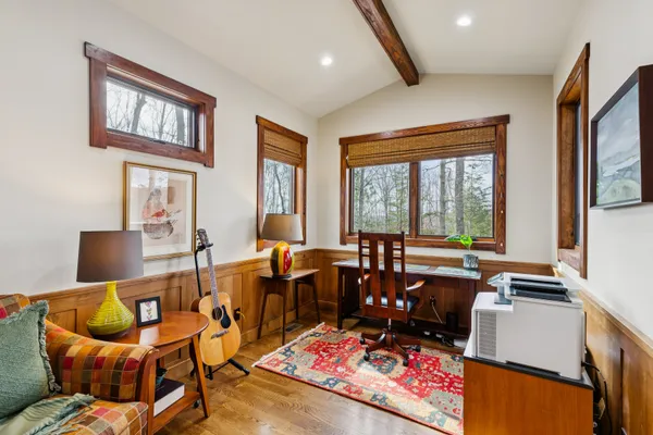 a blue bench sitting in front of a window