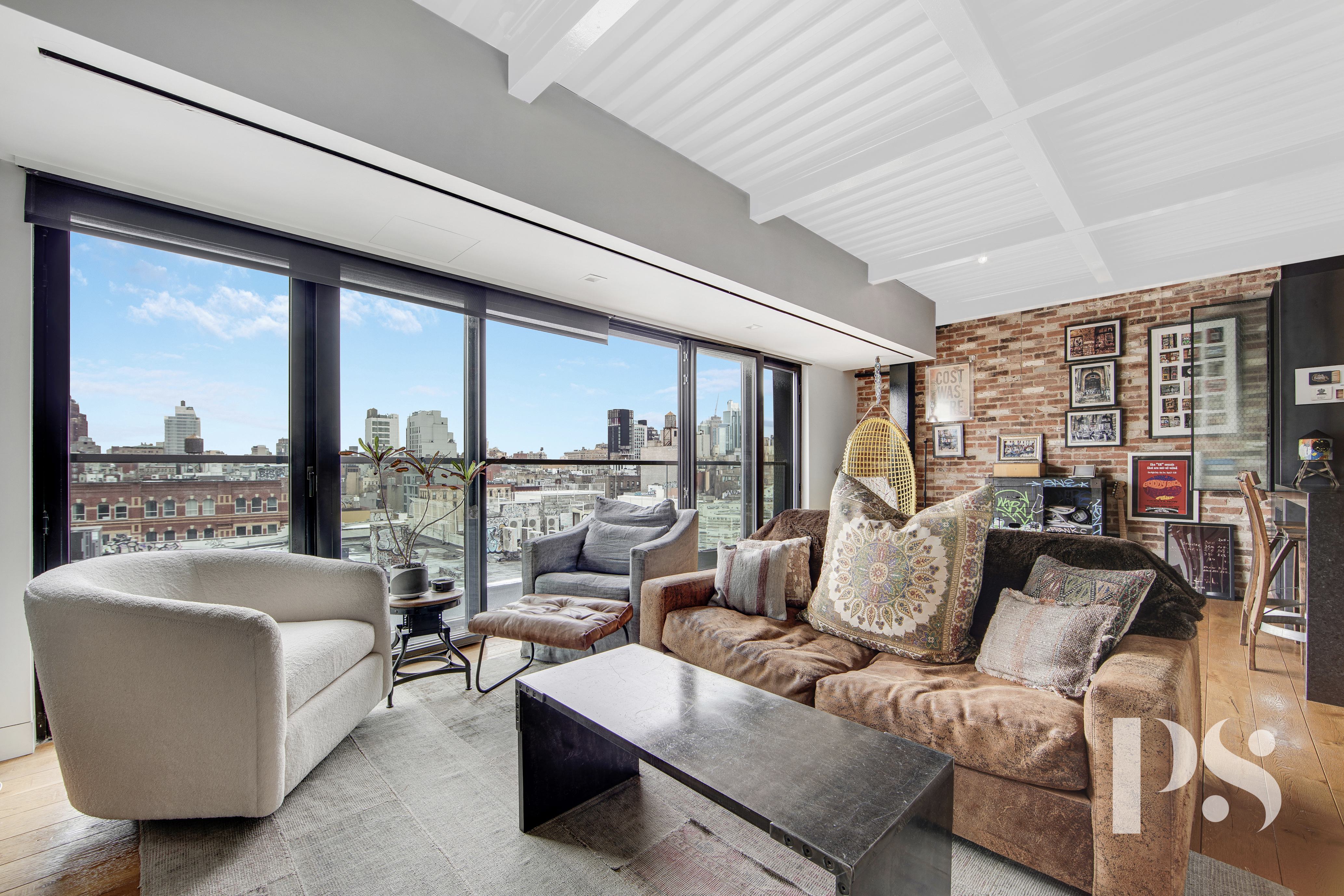 60 Orchard Street, Unit PH Manhattan, NY 10002 - Photo 2 of 19 a living room with furniture and a large window